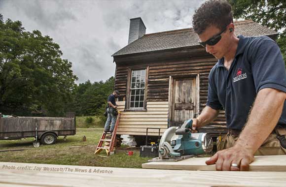 News photo of Charles Sweeny cabin restoration project