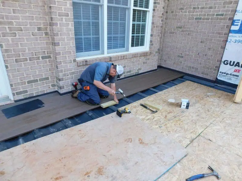 Deck Installation with Composite Decking for Sunroom Addition