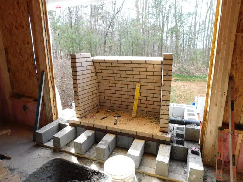 Sunroom level fireplace is started for Home Addition