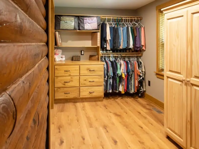 Appomattox home addition featuring custom storage cabinets, built-in closet shelving, and a functional laundry area.