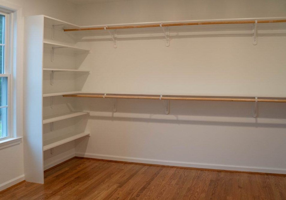 Home Addition with Custom Shelves in Walk-In Closet