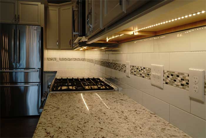 Tile work highlighted by under counter lighting in Appomattox, Virginia custom home 