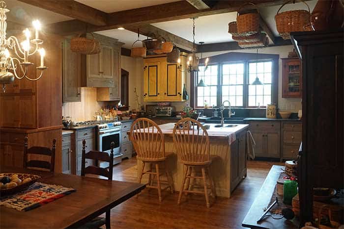 Early American inspired kitchen with custom antique modeled cabinets