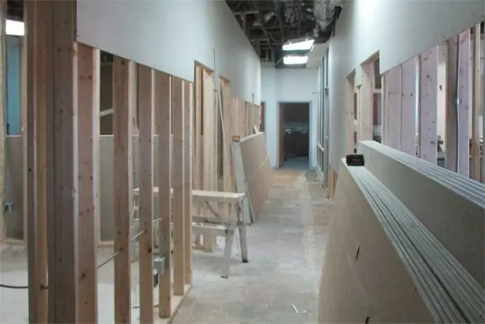 New drywall being hung during the renovation project