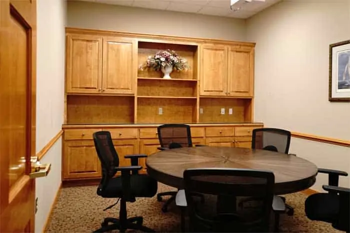 Renovated conference room with custom built cabinetry