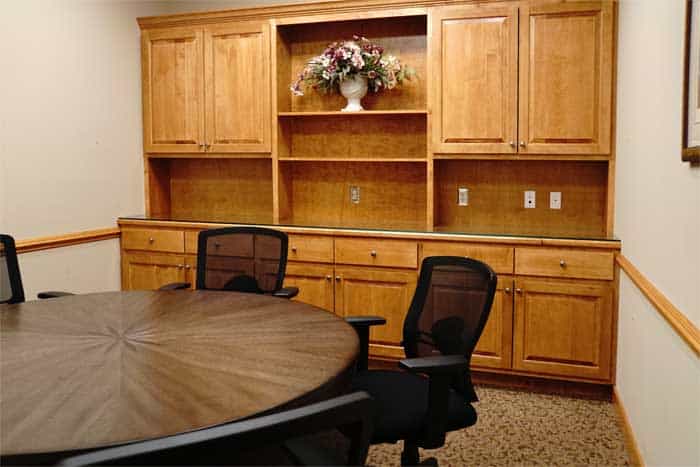 Renovated conference room with custom built cabinetry